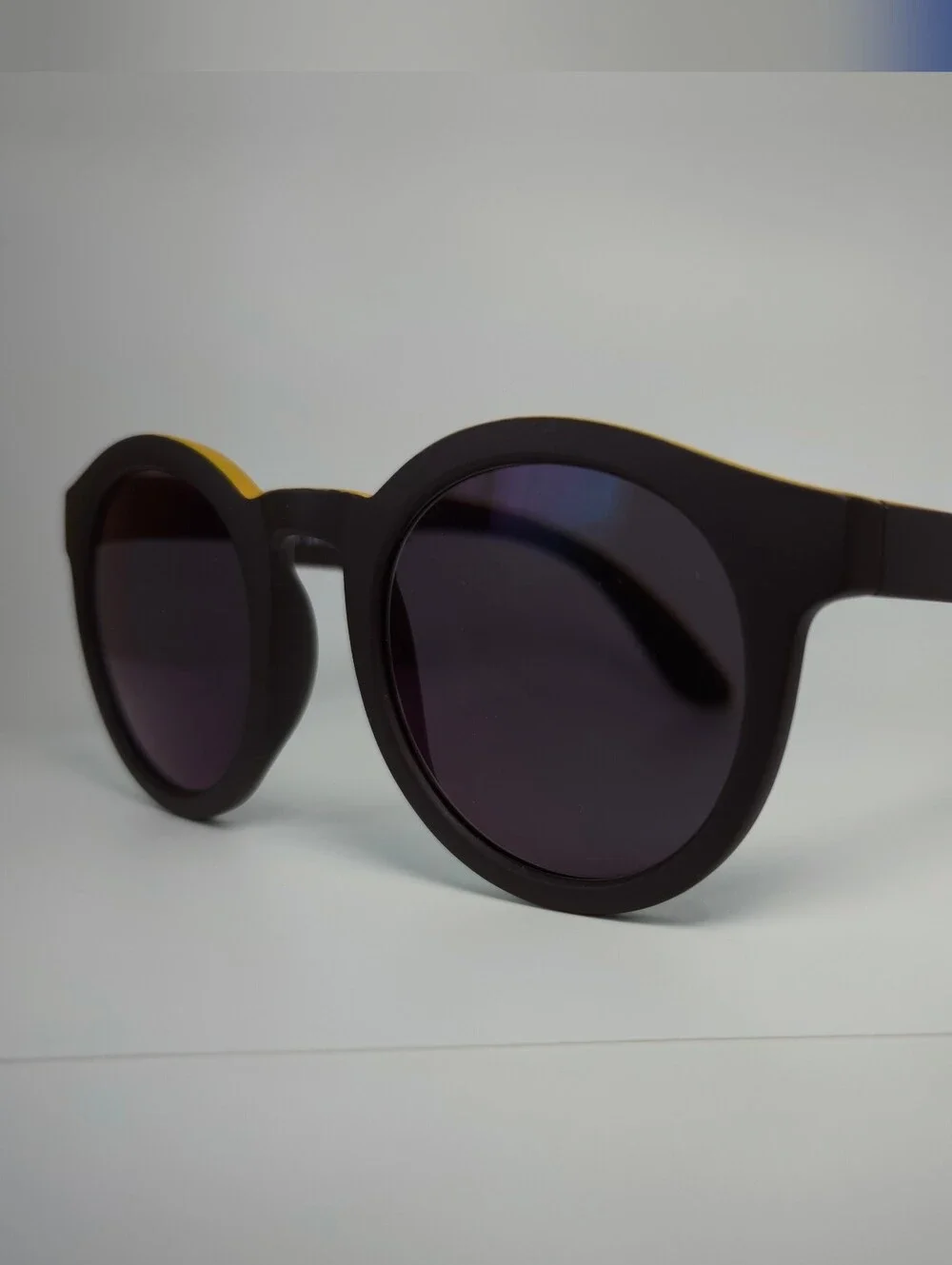 Oasis. Men's Black Round Frame. Deep Chocolate, Yellow Top.